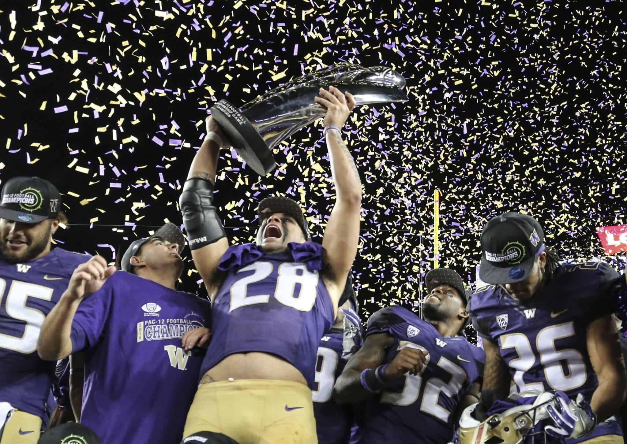 Washington Huskies Washington Huskies celebrate following the Pac-12 Championship game against the Colorado Buffaloes in Santa Clara, Calif. on Friday, Dec. 2, 2016. Washington defeated Colorado 41-10. (Spencer Allen/IOS via AP Images)