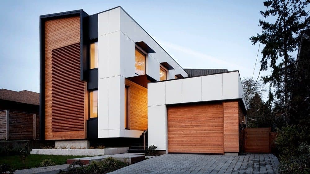 Ballard Passive_Tim Bies_001 copy 2 hero-min The roof slopes to the south for greater solar-panel efficiency and the one-car garage was among several tradeoffs to improve energy efficiency.