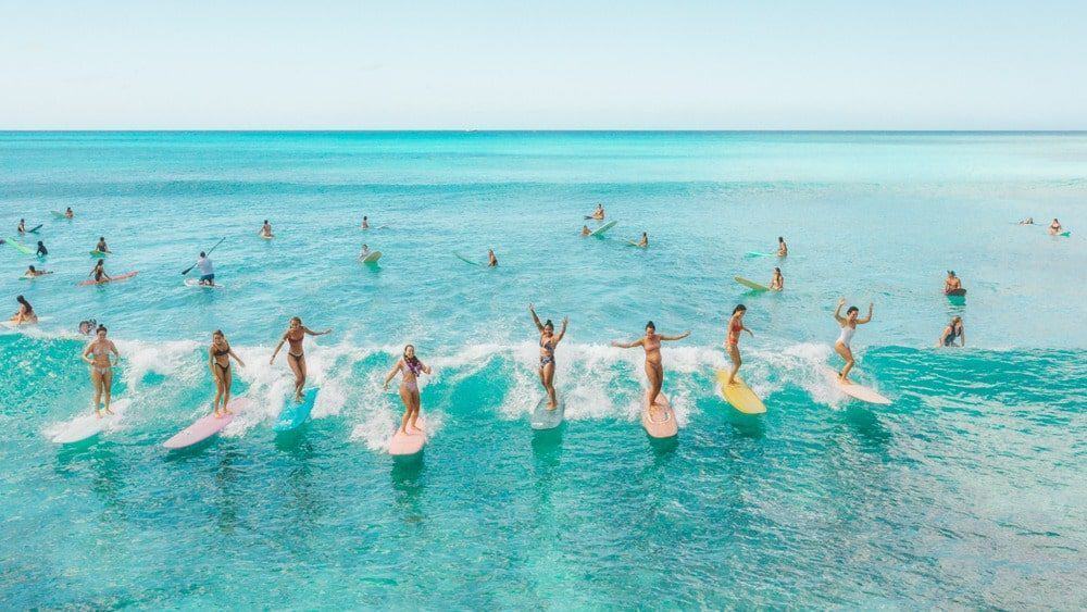Copy of Copy of KBH_Surfer_Ladies_FINAL copy hero-min Take surf lessons at the Kaimana Beach Surf Shop.