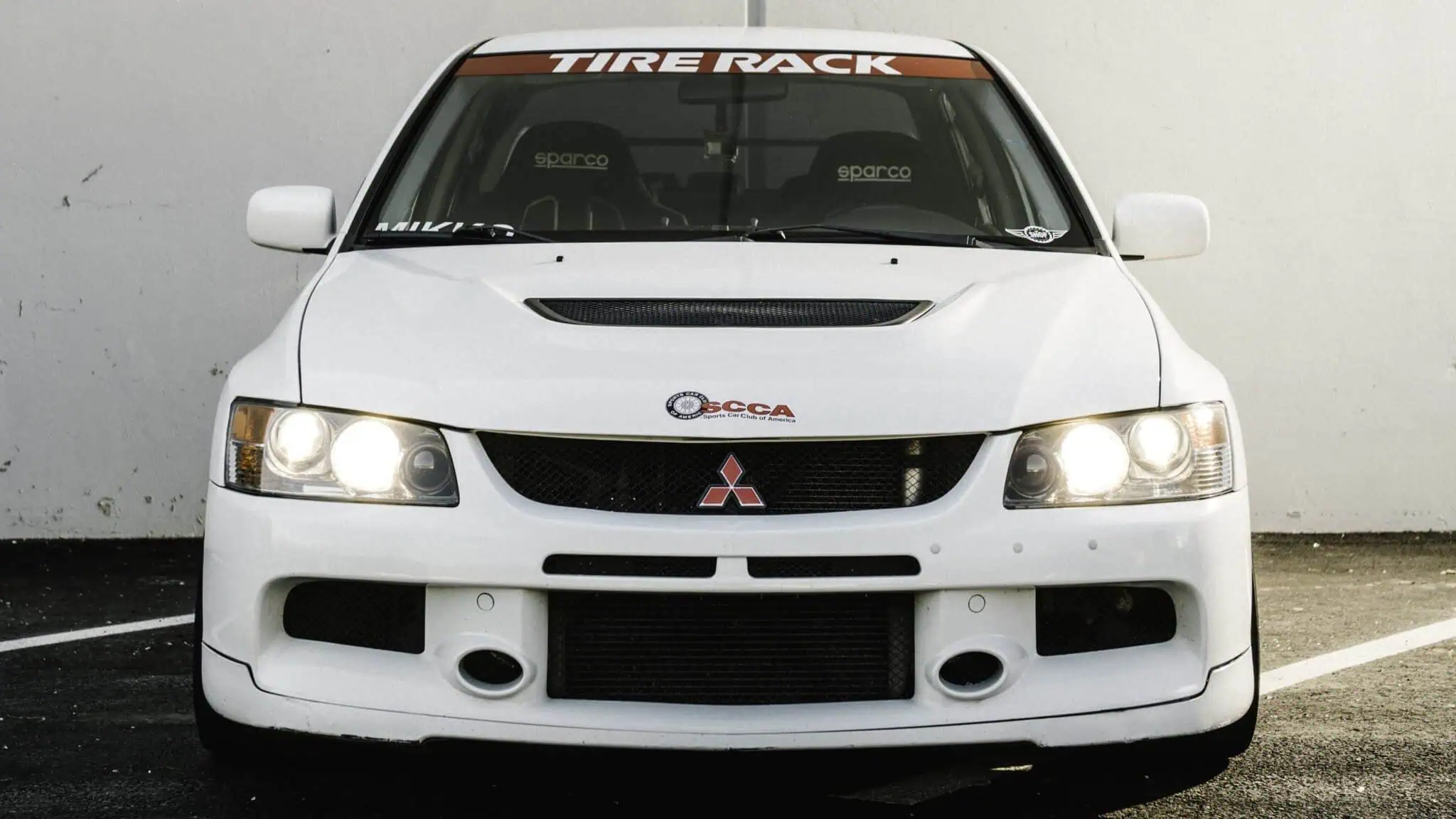 _DSC8193-Edit Cropped-min Tasha Mikko’s race car is a 2006 Mitsubishi Evo 9. She named it “Robbie” in honor of her grandfather.