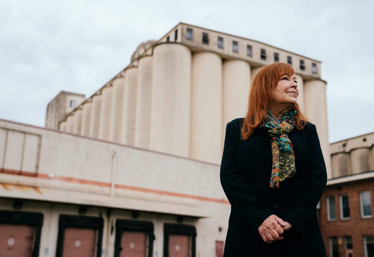 KATE BECKER HarborIslandSoundstage02 Kate Becker, Creative Economy and Recovery Director for King County Executive Dow Constantine, stands for a portrait outside Harbor Island Studios sound stage in Seattle, Friday, March 11, 2022. The 117,000 square foot warehouse is in the former Fisher Flour Mill location.