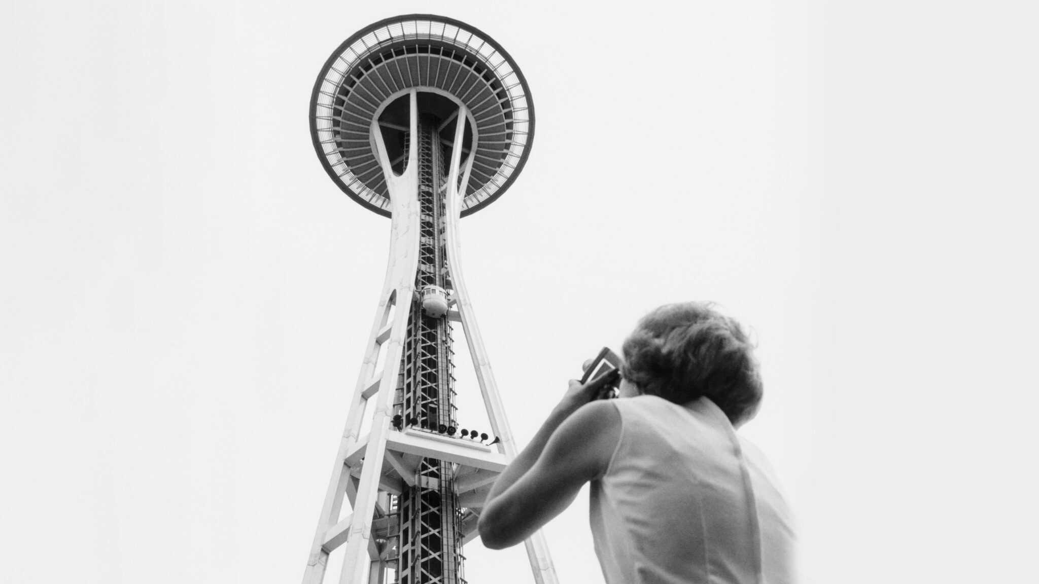 Seattle-Space-Needle_2048x1152 Shirley Farnham taking photo of Space Needle, Seattle World's Fair, 1962